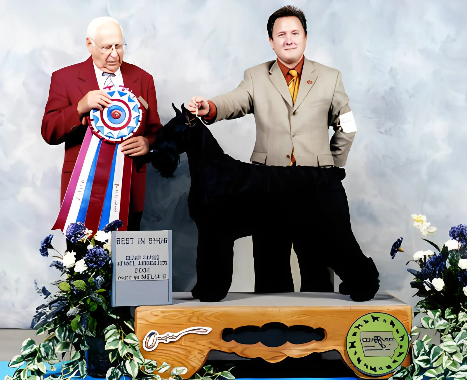 Proud handlers with award-winning dog